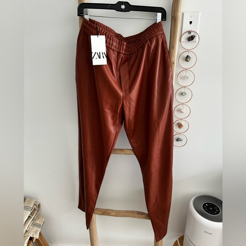 Zara faux leather pants in a nice rust color Size M